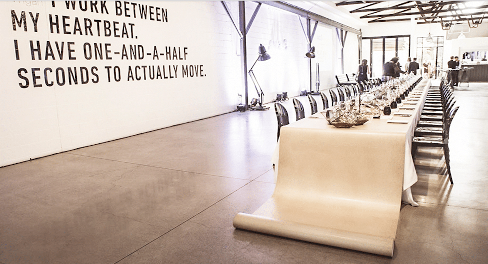 Minimalist dinner setting with tactile materials and intimate lighting